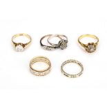 A group of six rings, including diamond and imitation diamond-set examples, two with UK hallmarks