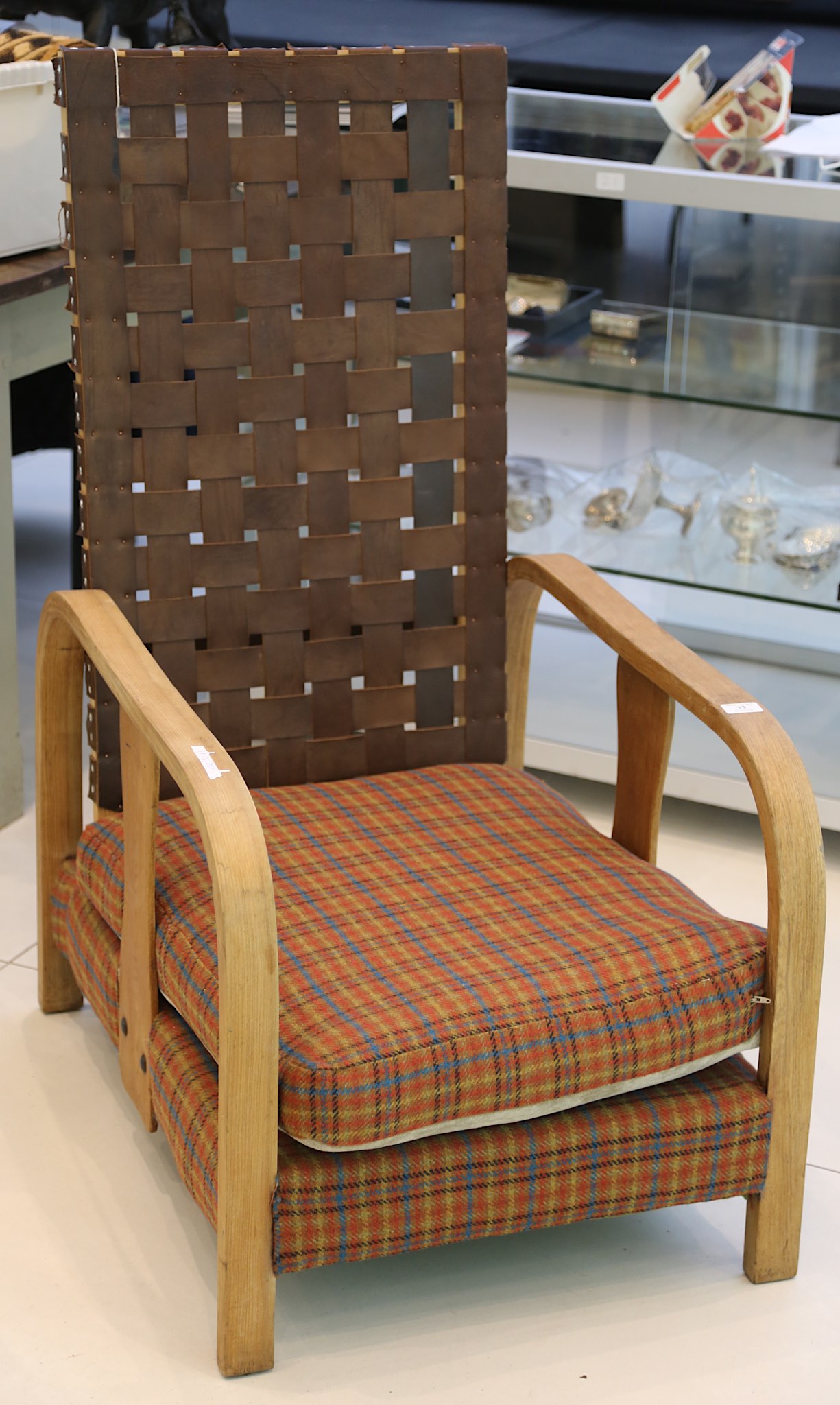 Arts and Crafts style bentwood oak armchair with leather lattice strap back over a tartan fabric