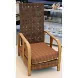 Arts and Crafts style bentwood oak armchair with leather lattice strap back over a tartan fabric