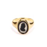 A hardstone cameo signet ring, The oval agate cameo carved to depict a gentleman in profile facing
