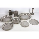 Four 18th Century English pewter dishes, two dated 1733 / 1740, a later pewter tobacco jar,