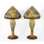 A pair of Gallé style glass lamps of mushroom shape, decorated butterflies and flowers,