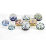 A group of nine mainly Scottish glass paperweights, the largest with cartwheel millefiori design, 8.