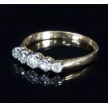 A diamond five-stone ring set to an 18ct gold band,