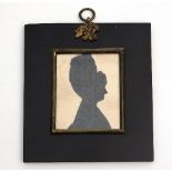 A Regency silhouette bust portrait of a lady, wearing a ribboned bonnet, 7.