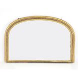 A Victorian arch top overmantel mirror with moulded frame,