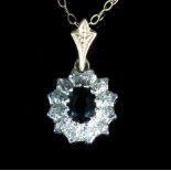 A sapphire and diamond cluster pendant,