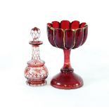 A Bohemian red glass goblet, the bowl of lobed form, 19.