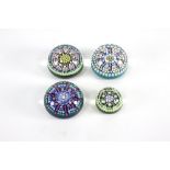 A collection of three Perthshire glass paperweights,