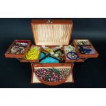 A large quantity of costume jewellery including bead necklaces, ear clips,