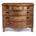 A Regency mahogany serpentine chest of three short and three long drawers,