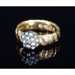 A Victorian 18ct gold wedding band with later set seed pearl cluster,