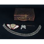 A leather jewellery box containing an Indian silver fringe necklace marked PAR,