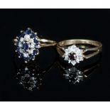 A sapphire and diamond cluster ring of tiered oval form set in a 9ct gold band,