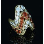 An aquamarine and garnet ring by H Stern,