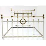 A brass plated and painted double bed frame,