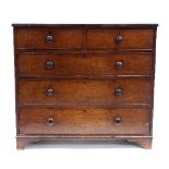 A mahogany chest of two short and three long drawers, with turned handles, on bracket feet,