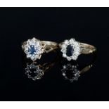 A sapphire and diamond cluster ring with pierced shoulders to a 9ct gold band,