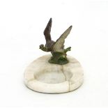 A cold painted bronze and onyx ashtray modelled with a mallard in flight, on a shaped onyx base,