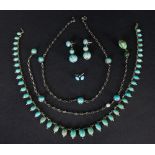 A group of turquoise set jewellery comprising a graduated oval set necklace,