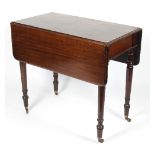 A Victorian mahogany two-flap Pembroke table on turned legs,