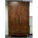 A French provincial elm and chestnut armoire,