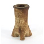 An early pottery candlestick with pinched base,