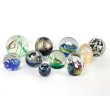 A group of ten various glass paperweights,