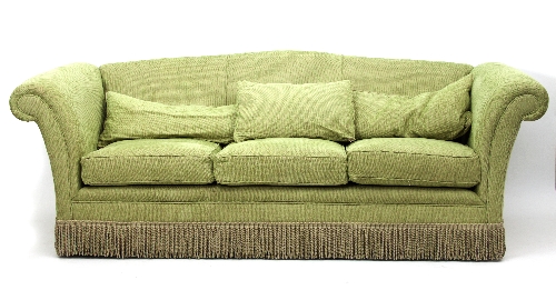 A near pair of upholstered three-seater sofas,