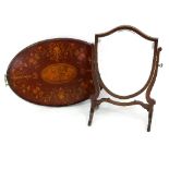 A mahogany shield shape swing mirror, 42cm wide and an inlaid tea tray with wavy rimmed gallery,