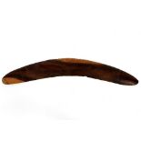 A hardwood boomerang, incised leaves,