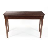 A mahogany side table with plain frieze on square taper legs,