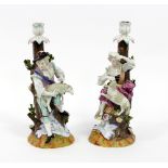 A pair of Continental figural candlesticks, The Shepherd and Shepherdess, underglaze AR script,