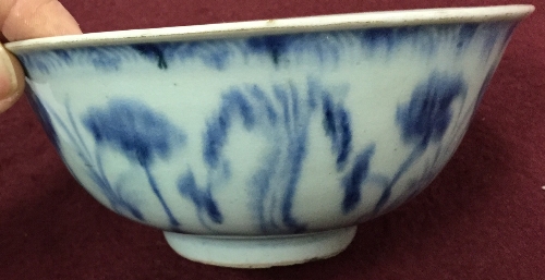 A Chinese provincial blue and white bowl, Ming dynasty, painted with flowers, 15. - Image 4 of 5