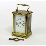 A gilt brass cased carriage clock, the dial with Roman numerals,