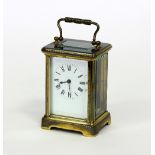 A gilt brass eight-day carriage clock, 14.