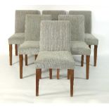 A set of six upholstered dining chairs with plain square tapered legs and removable grey covers