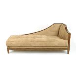 A beech framed upholstered chaise longue on square tapering legs,