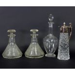 A pair of cut glass ships decanters and stoppers of stepped form, 23.