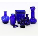 A collection of Bristol blue glass, including three vases,