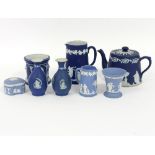 A quantity of Wedgwood jasperware including teapot (damaged), jugs, vases, etc.