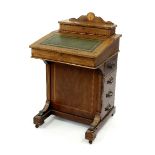 A mahogany and satinwood banded Davenport with tooled leather sloping front,