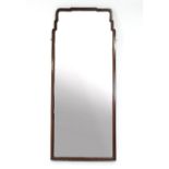 A mahogany framed wall mirror with bevelled glass,