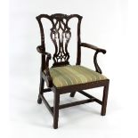 A mahogany open armchair with fretwork back,