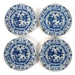 Four late 17th and early 18th Century Delft plates of Oriental design, painted palisades,