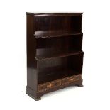 An Edwardian inlaid bookcase of three shelves fitted over two drawers,