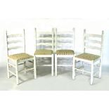 A set of four dining chairs, painted white,