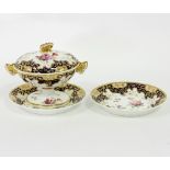 A Spode dessert tureen, cover and two stands, painted roses within gilt reserves and blue borders,