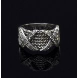 A diamond dress ring, of ropetwist design with diamond set double X, in unmarked white metal,