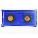 A studio glass dish of rectangular form with fused orange and green decoration,